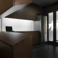 The slope of the entrance foyer piece reflects the inclined shoe rack in the bottom cabinet