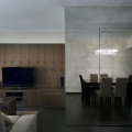 Living and dining room reflected on mirrored wall hiding household shelter