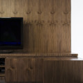 The large wooden grain textures that clothed the furniture took inspiration from Miesian aesthetics