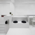 The string of furniture transforming from table top, reception seating, storage and finally to pantry space